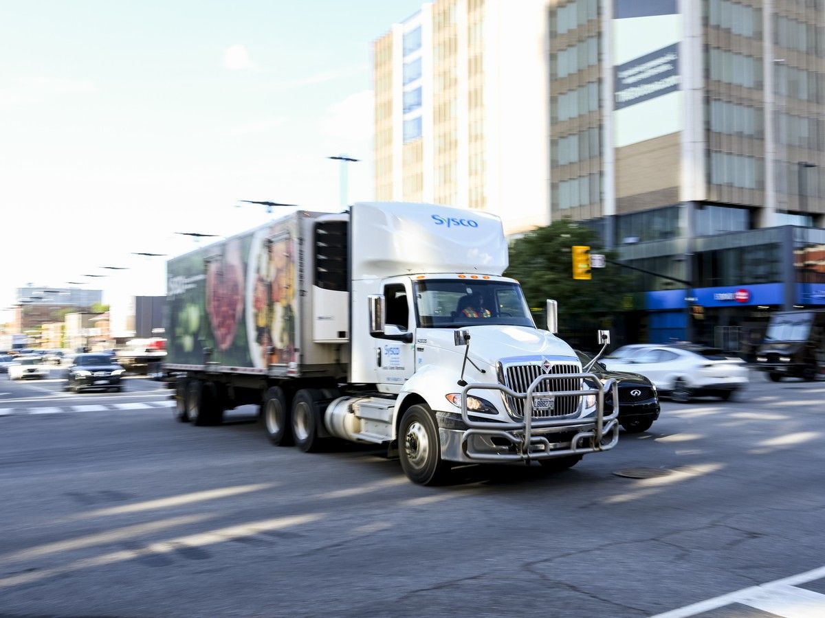 A truck passes through the intersection of King Edward Avenue and Rideau Street in downtown Ottawa on Tuesday, Aug. 18, 2026.