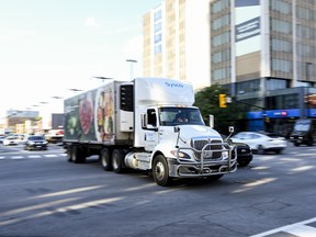 A truck passes through the intersection of King Edward Avenue and Rideau Street in downtown Ottawa on Tuesday, Aug. 18, 2026.