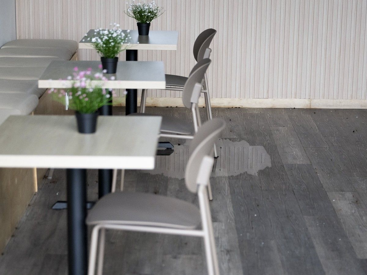 Damage to the floor of Moo & Bean Cafe. Damage to the floor of Moo & Bean Cafe.