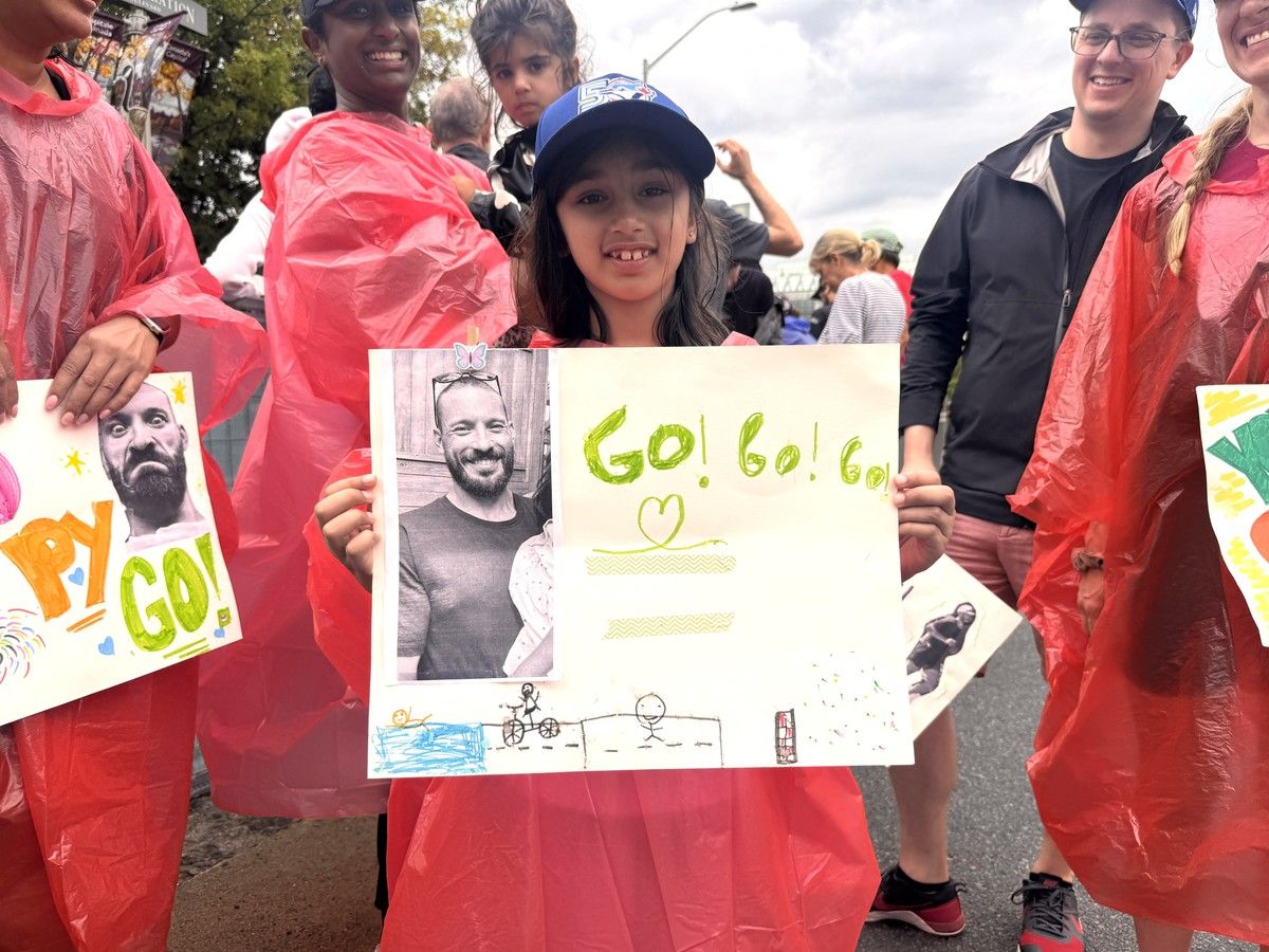 Kaia Eliora Naidoo-Masse, an eight-year-old artist from Toronto, holds a sign she handmade in support of Ironman Canada-Ottawa contestant Patrick Grzelak. Kaia Eliora Naidoo-Masse, an eight-year-old artist from Toronto, holds a sign she handmade in support of Ironman Canada-Ottawa contestant Patrick Grzelak.