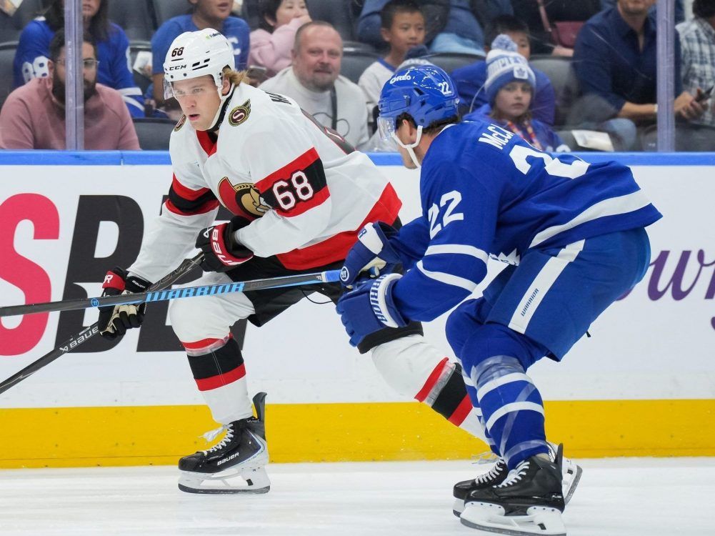 Kasper Halttunen of the Ottawa Senators (left) skates