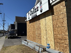 CuTzz barber shop with boards around it