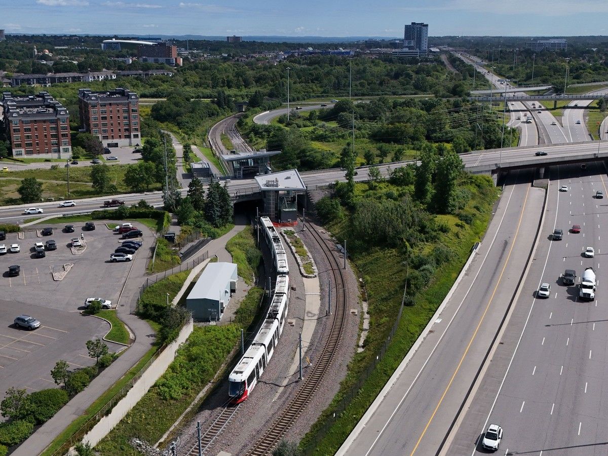 OC Transpo LRT train and tracks at Cyrville Station.