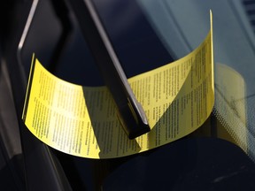 A file photo shows an Ottawa By-Law parking ticket on the windshield of a vehicle.