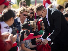 Brady Tkachuk signs autographs during the Ottawa Senators' annual Fan Fest at the Canadian Tire Centre in September 2025.