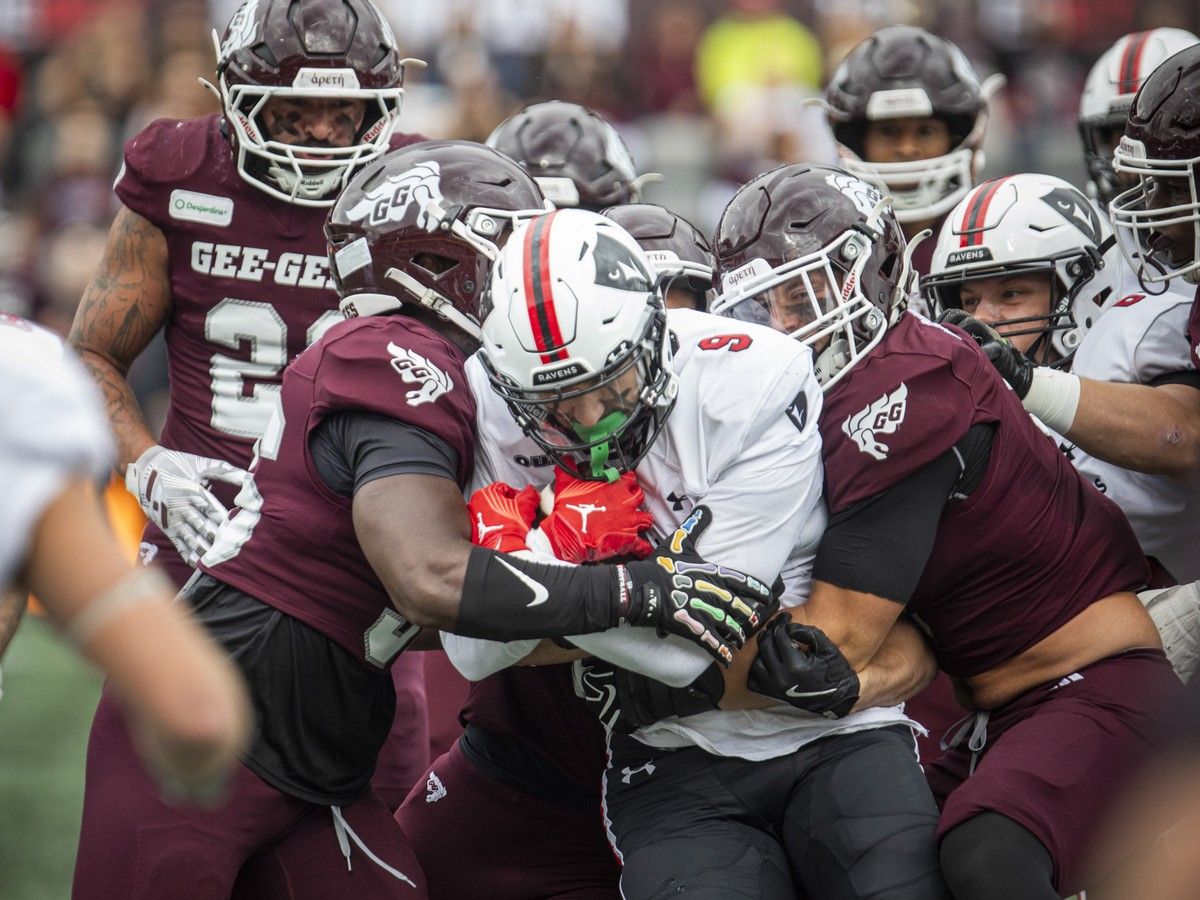  The Carleton Ravens take on the University of Ottawa Gee-Gees in the annual Panda Game at TD Place in Ottawa on Sunday, Oct. 4, 2026. Raven Dante Spadaccini gets wrapped up by Gee-Gees tacklers.