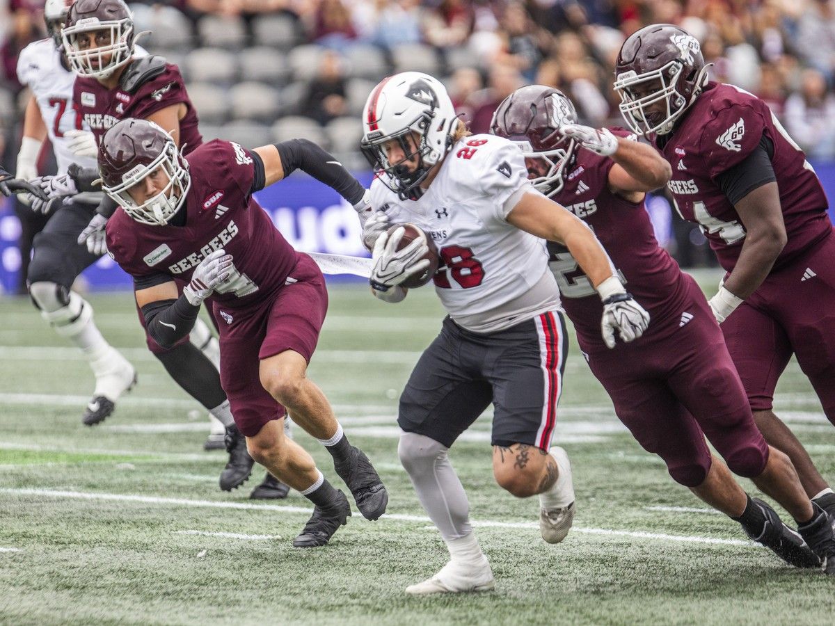  The Carleton Ravens take on the University of Ottawa Gee-Gees in the annual Panda Game at TD Place in Ottawa on Sunday, Oct. 4, 2026. Raven Matthew Morin runs the ball with Gee-Gees in pursuit Sunday.