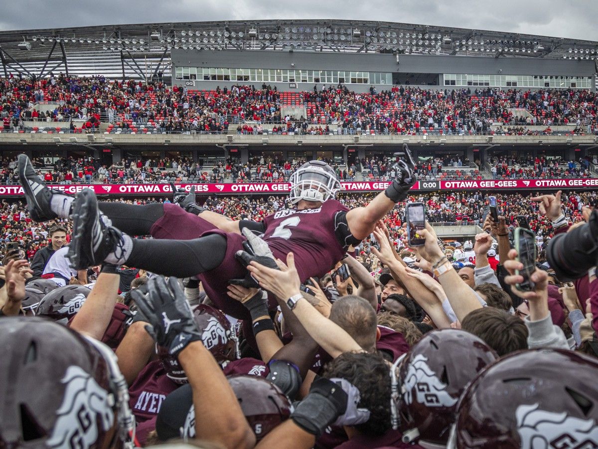 University of Ottawa Gee-Gees players, staff and fans flood the field at TD Place to celebrate a 35-32 win over the Carleton Ravens in the Panda Game on Sunday, Oct. 4, 2026.