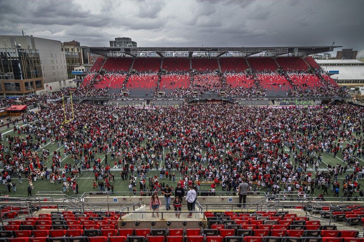  University of Ottawa Gee-Gees players, staff and fans flood the field at TD Place to celebrate a 35-32 win over the Carleton Ravens in the Panda Game on Sunday, Oct. 4, 2026.