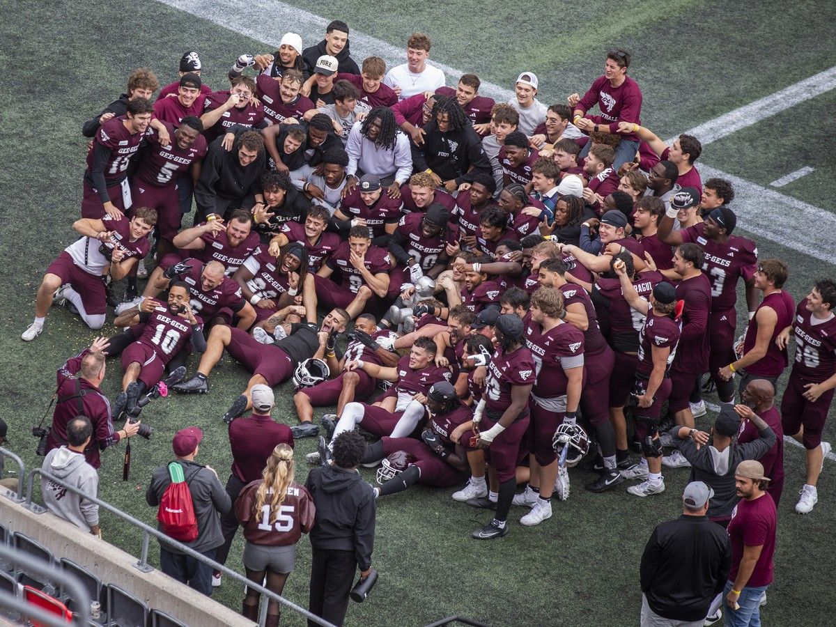  University of Ottawa Gee-Gees players pose for a team photograph with the Panda Game trophy at TD Place after defeating the Carleton Ravens 35-32 on Sunday, Oct. 4, 2026.