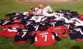 Ottawa Titans infielder AJ Wright poses in a sea of Brady Tkachuk jerseys. Fans had the chance to trade in their old Tkachuk jerseys for a No. 7 Ottawa Titans AJ Wright jersey as part of the Titans 'Forget brady Day' on July 7, 2026.
