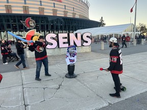 Influencer Jamal Choudhry riles up fellow Ottawa Senators fans to take swings at his makeshift Brady Tkachuk effigy outside the main entrance to the Canadian Tire Centre before the NHL contest between the Ottawa Senators and Florida Panthers on Wednesday, Oct. 21, 2026.