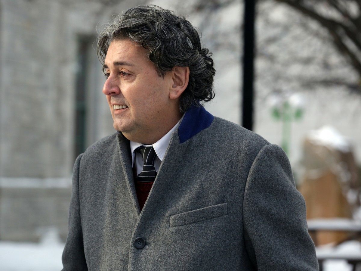  Father Joe LeClair leaves the Elgin St. courthouse in Ottawa on Monday, Jan. 20, 2014.