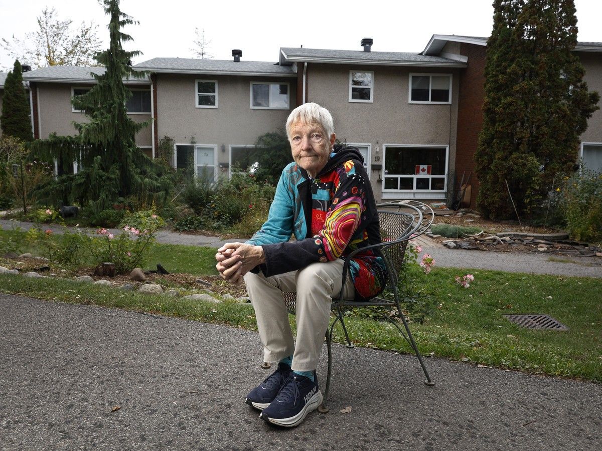 Linda Thom, a resident of 551 Riverdale Ave., poses for a photo outside her home.