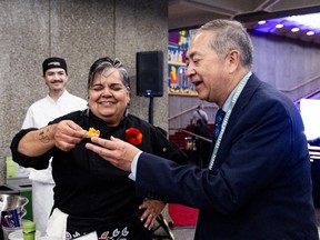 Ottawa Citizen food critic Peter Hum, right, meets with chef Trudy Metcalfe-Coe at the Tuktu Catering station during the Ottawa Citizen Best Restaurants 2026 event at the National Arts Centre on Monday.