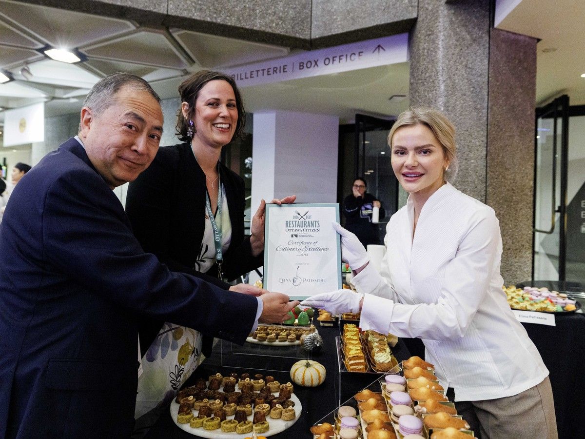 Editor-in-chief of the Ottawa Citizen Nicole Feriancek, centre, and Ottawa Citizen restaurant critic Peter Hum, left, present Elina Olefirenko of Elina Patisserie restaurant with a Certificate of Culinary Excellence award during the Ottawa Citizen Best Restaurants 2026 at the National Arts Centre on Monday. Editor-in-chief of the Ottawa Citizen Nicole Feriancek, centre, and Ottawa Citizen restaurant critic Peter Hum, left, present Elina Olefirenko of Elina Patisserie restaurant with a Certificate of Culinary Excellence award during the Ottawa Citizen Best Restaurants 2026 at the National Arts Centre on Monday.