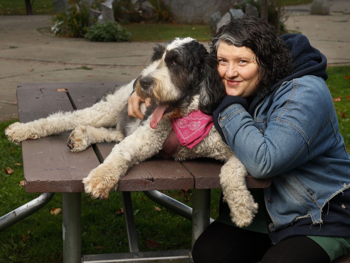 Harriet Clunie and her dog Peggy pose for a photo in Ottawa. Cluniet had to stop being a chef due to chronic fatigue and fibromyalgia.