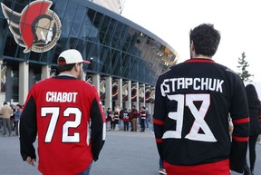Ottawa Senators fans arrive for Wednesday's game at the Canadian Tire Centre after making changes to their Brady Tkachuk jerseys.