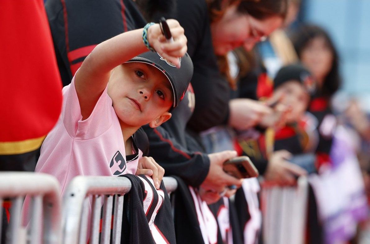 A youthful autograph seeker joins Ottawa Senators fans in welcoming the NHL team’s players to the Canadian Tire Centre before Thursday’s home opener against Philadelphia. A youthful autograph seeker joins Ottawa Senators fans in welcoming the NHL team’s players to the Canadian Tire Centre before Thursday’s home opener against Philadelphia.