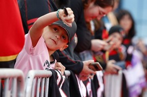 Senators fan seeking autograph