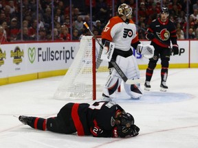 Ottawa Senators forward William Eklund goes down
