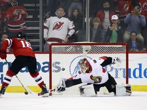New Jersey Devils forward Drew Stafford beats Mike Condon in the shootout on Friday night. Condon has given up four goals on just seven attempts this season. (Getty Images)