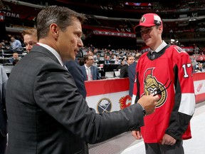 CHICAGO, IL - JUNE 24:  Drake Batherson meets with coach Guy Boucher after being selected 121st overall by the Ottawa Senators during the 2017 NHL Draft at the United Center on June 24, 2017 in Chicago, Illinois.