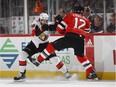 Max McCormick stops Ben Lovejoy of the Devils with a check during the Senators' game at New Jersey last Friday night. Bruce Bennett/Getty Images