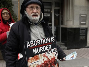 Cy Winter stands on Bank St. just outside The Morgentaler Clinic where he's protested abortions for the past four and a half years Monday December 07, 2015.