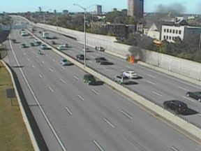 Smart Car on fire on Highway 417 during lunch hour. There were no injuries.
