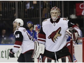 Arizona Coyotes goalie Adin Hill and Jordan Martinook react after the New York Rangers' Michael Grabner scored a goal during a game on Thursday night. AP Photo/Frank Franklin