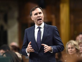 Minister of Finance Bill Morneau rises during Question Period in the House of Commons on Parliament Hill, in Ottawa on Thursday, Oct. 26, 2017.