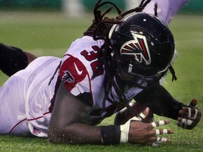 Strong safety Kemal Ishmael of the Atlanta Falcons recovers a fumble against the New York Jets at MetLife Stadium on October 29, 2017 in East Rutherford, New Jersey