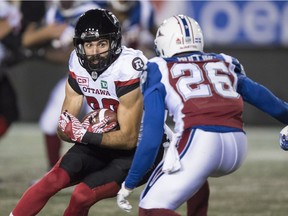 Redblacks wide receiver Brad Sinopoli tries to get by Alouettes defensive back Tyree Hollins during an Aug. 31 game in Montreal. Sinopoli's injury-shortened season will end with 91 catches for 1,009 yards. THE CANADIAN PRESS/Paul Chiasson