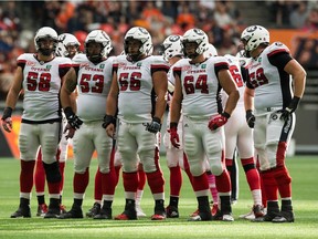 Waiting for play to resume during an Oct. 7 game against the B.C. Lions in Vancouver are Redblacks offensive linemen, left to right, Jason Lauzon-Seguin, Matthew Albright, Alex Mateas, Evan Johnson and Jake Silas. THE CANADIAN PRESS/Darryl Dyck