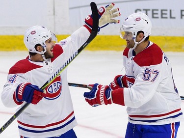Canadiens captain Max Pacioretty (67) celebrates with centre Phillip Danault after scoring in the first period against the Senators. THE CANADIAN PRESS/Sean Kilpatrick