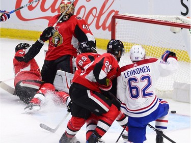 Canadiens winger Artturi Lehkonen (62) scores as the Senators Alex Burrows (14) gets tangled up with goalie Craig Anderson (41). THE CANADIAN PRESS/Sean Kilpatrick