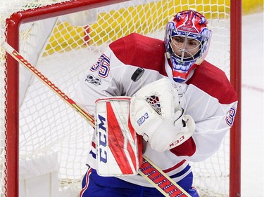 Canadiens goalie Al Montoya makes a glove against the Senators during first-period action. THE CANADIAN PRESS/Sean Kilpatrick