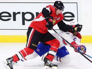 Canadiens winger Max Pacioretty (67) get pushed to the ice by Senators defenceman Dion Phaneuf in the second period. THE CANADIAN PRESS/Sean Kilpatrick