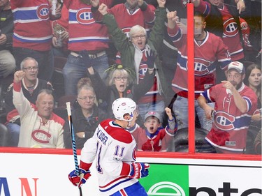 Canadiens fans go cheer as right-winger Brendan Gallagher (11) celebrates a second-period goal against the Senators. THE CANADIAN PRESS/Sean Kilpatrick