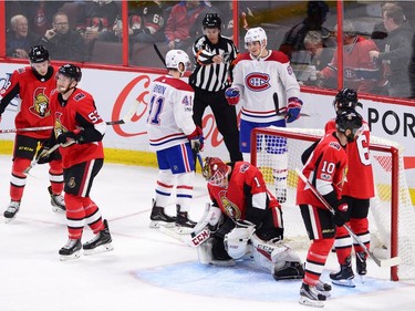 Canadiens winger Artturi Lehkonen, top, receives congratulations from Paul Byron as Senators goalie Mike Condon and his teammates hang their heads following a third-period goal. THE CANADIAN PRESS/Sean Kilpatrick