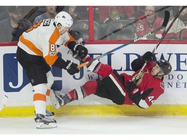 Jean-Gabriel Pageau Robert Hagg

Philadelphia Flyers defenceman Robert Hagg, left, collides with Ottawa Senators centre Jean-Gabriel Pageau along the boards during first period NHL action in Ottawa on Thursday, October 26, 2017. THE CANADIAN PRESS/Adrian Wyld ORG XMIT: ajw101
Adrian Wyld,