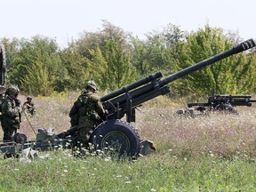 Operation Stalwart Guardian Members of the Royal Canadian Artillery 30th Field Regiment man one of the three C3 105mm howitzers that were deployed at the Owen Sound Billy Bishop Memorial Airport on Thursday, August 22, 2013.