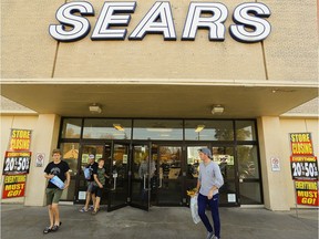 Shoppers exit Sears Canada store on Friday October 20, 2017.