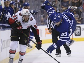 Toronto Maple Leafs center Nazem Kadri (43) is flipped up into the air after battling for the puck against Ottawa Senators defenseman Fredrik Claesson (33) in Toronto on Tuesday September 19, 2017. The Toronto Maple Leafs host the Ottawa Senators at the ACC. (Veronica Henri.Postmedia Network)