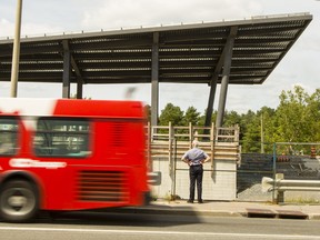 A man looks on as work continues on the Bayview LRT station in August.