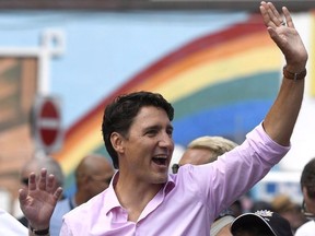 Prime Minister Justin Trudeau marches in the Ottawa Capital Pride parade, Sunday, Aug. 27, 2017.