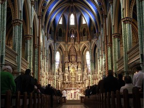 Archbishop Terrence Prendergast holds mass at Notre Dame Basilica in downtown Ottawa in this 2013 file photo.