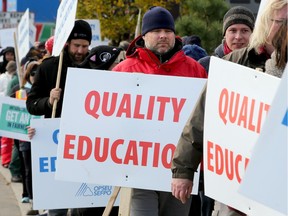 Algonquin College faculty picketed the office of local MPP Bob Chiarelli to pressure the government the help end the strike that has kept college students out of classes since Oct. 16.