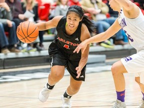 Point guard Jenjen Abella's savvy execution was critical
to the Carleton Ravens seventh consecutive Ontario University Athletics win
on Saturday at the Raven's Nest. (VALERIE WUTTI/PHOTO)